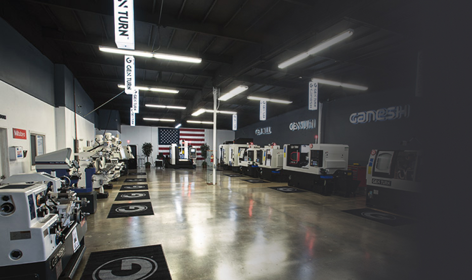 Interior of a large showroom featuring many CNC machines